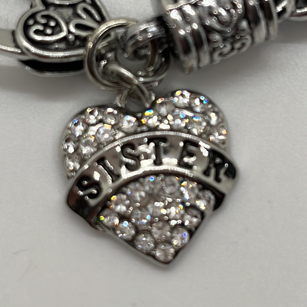Sister heart cubic zirconia charmed silver toned bracelet